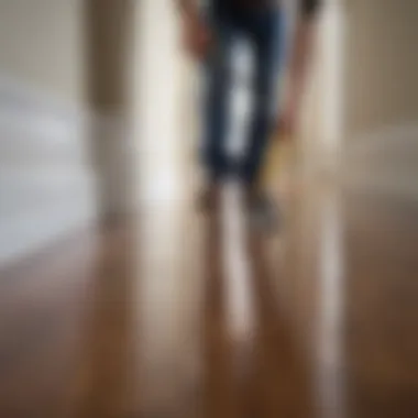 Attention to Detail in Baseboard Cleaning A person attentively cleaning the baseboards in a home environment