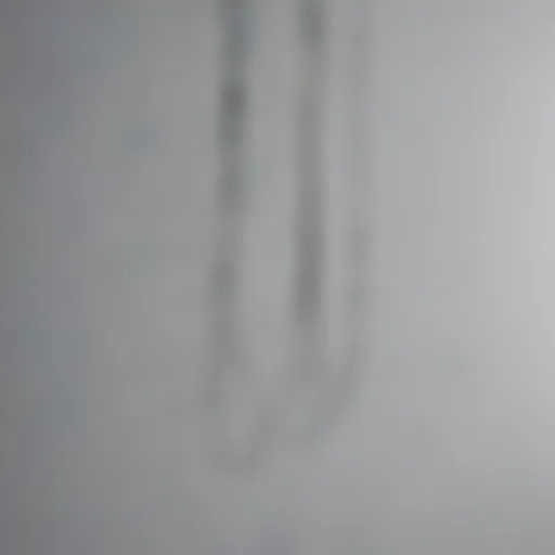 Close-up of wire hanging technique for artwork