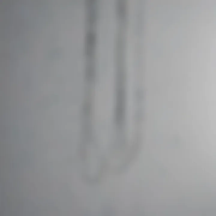 Close-up of wire hanging technique for artwork